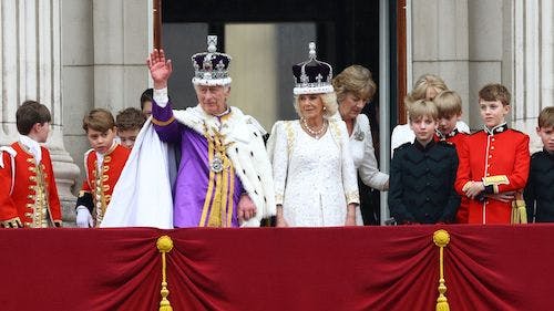 King Charles and Queen Camilla wave to their subjects