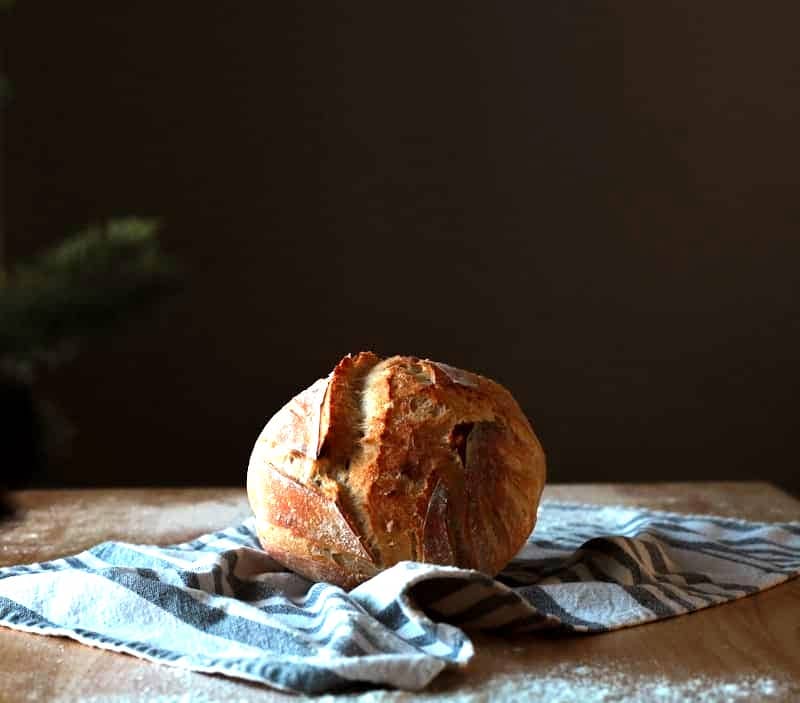 A loaf of bread sitting on top of a wooden table