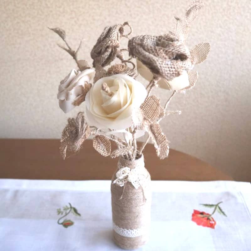 A vase filled with flowers sitting on top of a table