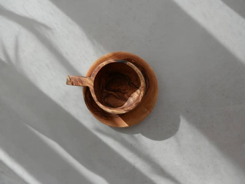 A brown vase sitting on top of a white floor