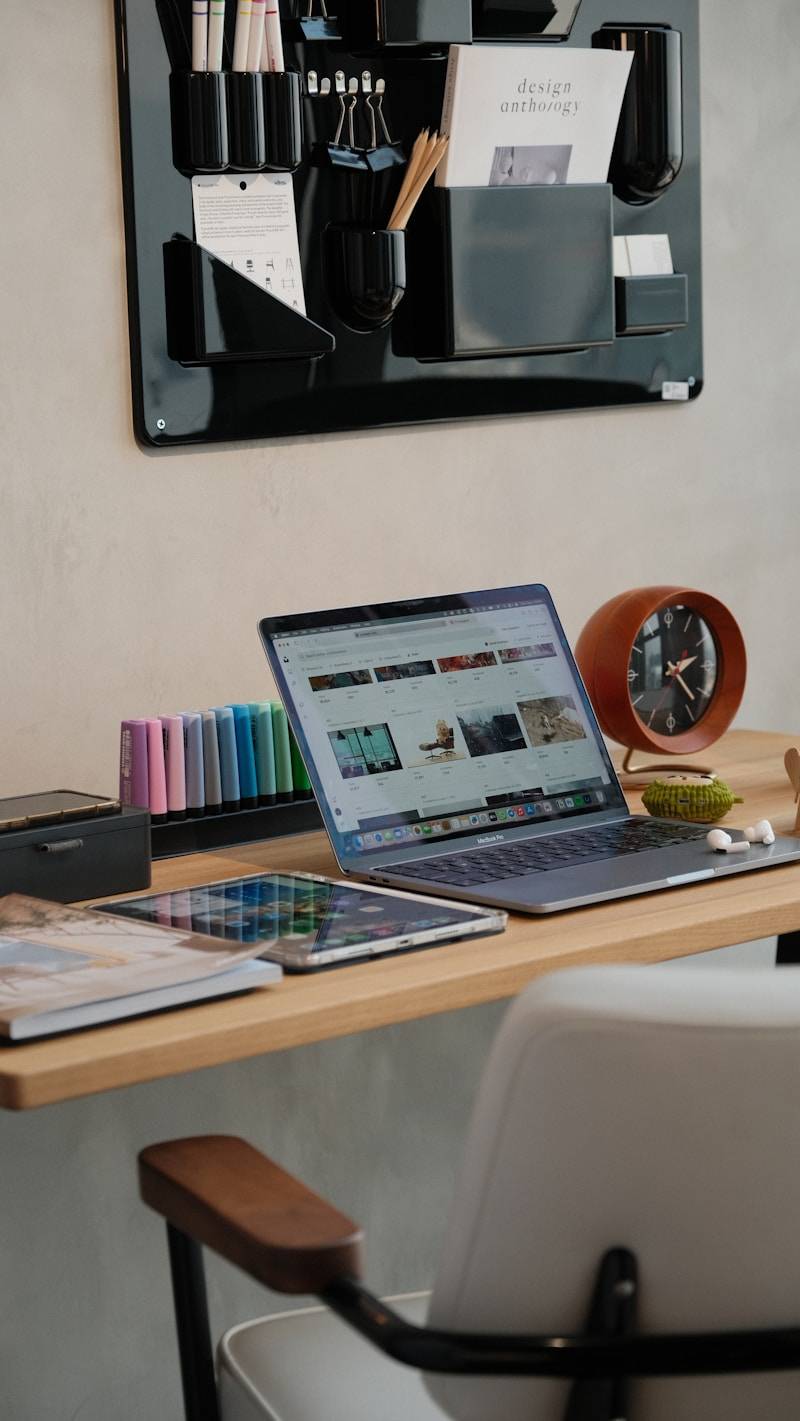 A modern desk setup with laptop and accessories.