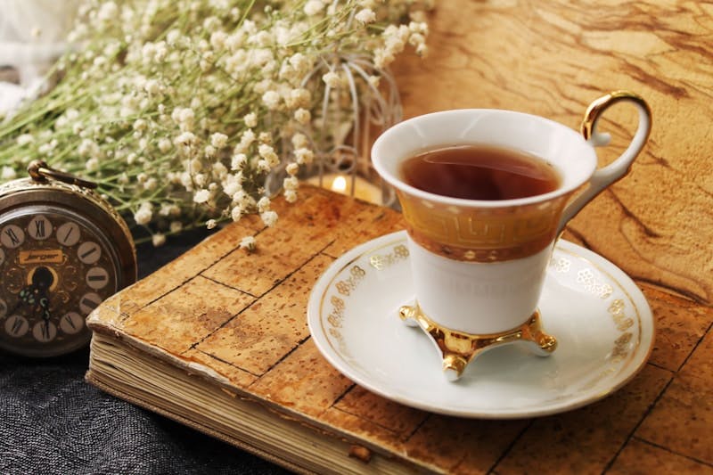 A cup of tea sitting on top of a wooden table