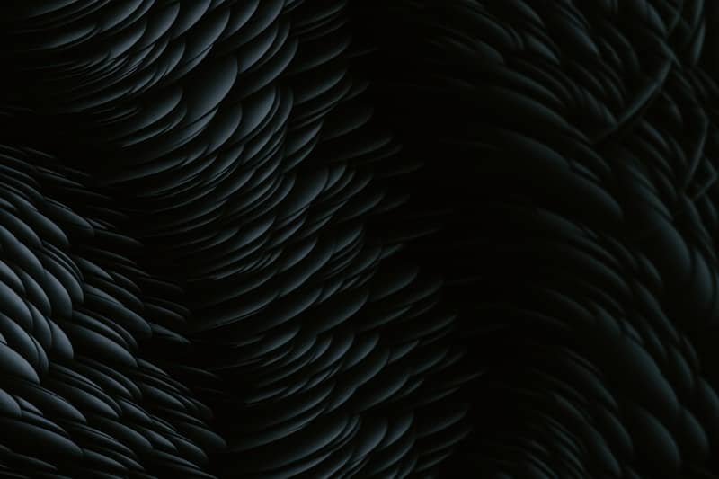 A black background with a pattern of wavy lines