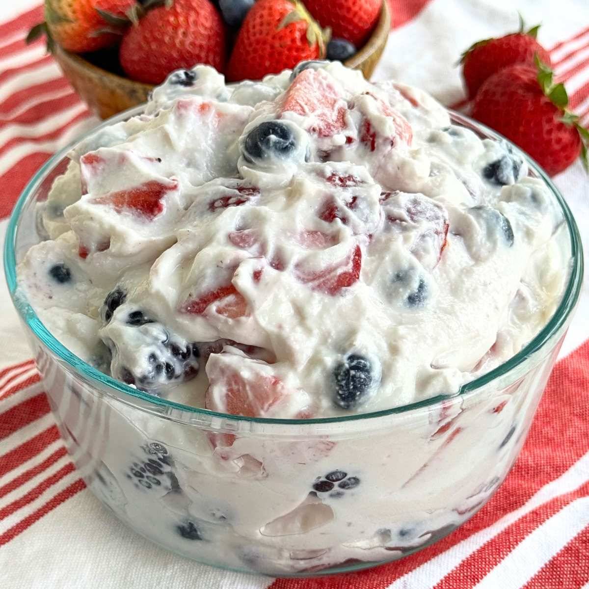 Cottage cheese fruit salad in a glass bowl.