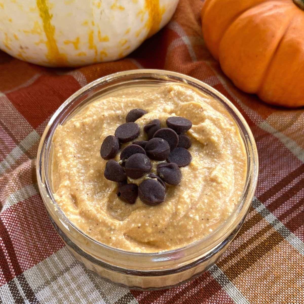 Whipped pumpkin cottage cheese topped with chocolate chips in a glass dish.