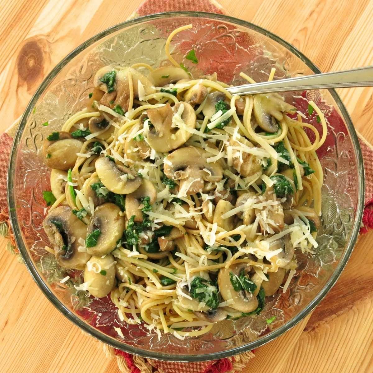 Mushroom Pasta on a glass plate with a fork.