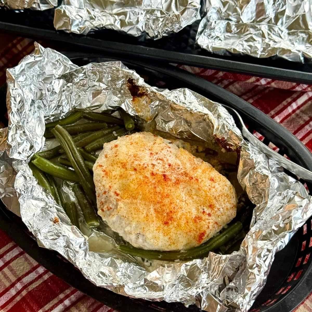 Baked ranch chicken foil packet with green beans.