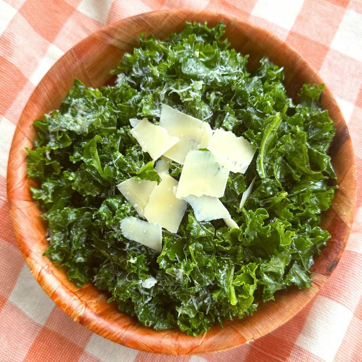 Kale salad in a brown bowl.