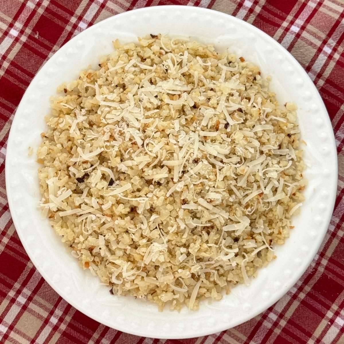 Roasted cauliflower rice in a white bowl.