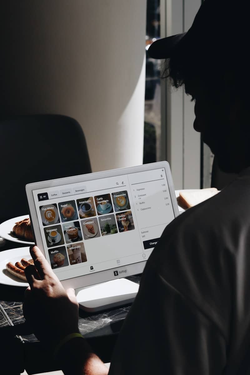 a person typing on a laptop on a table