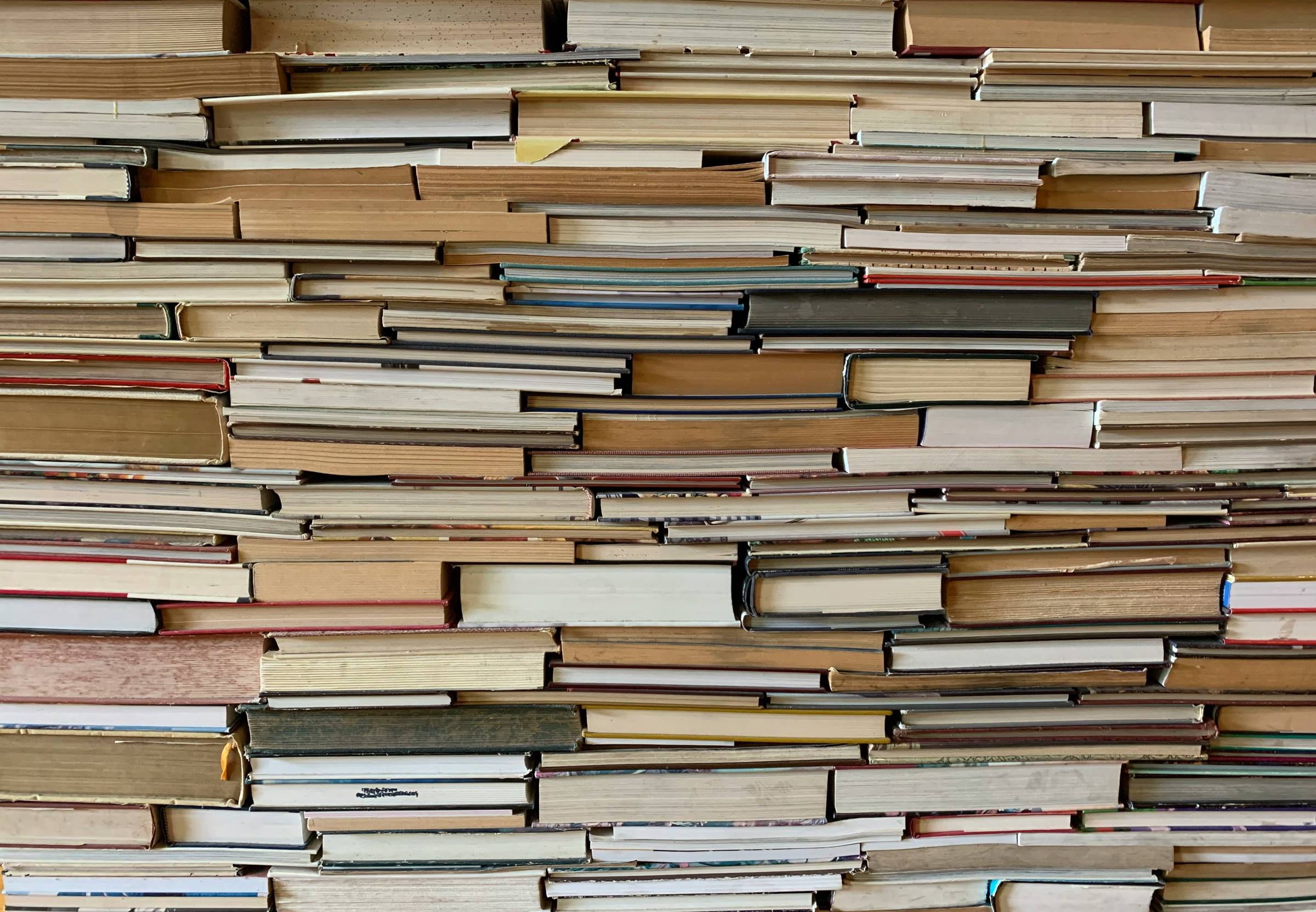 Photo by <a href="https://unsplash.com/@timwildsmith?utm_content=creditCopyText&utm_medium=referral&utm_source=unsplash">Tim Wildsmith</a> on <a href="https://unsplash.com/photos/brown-wooden-book-shelf-with-books-o2fc-C-Uotw?utm_content=creditCopyText&ut