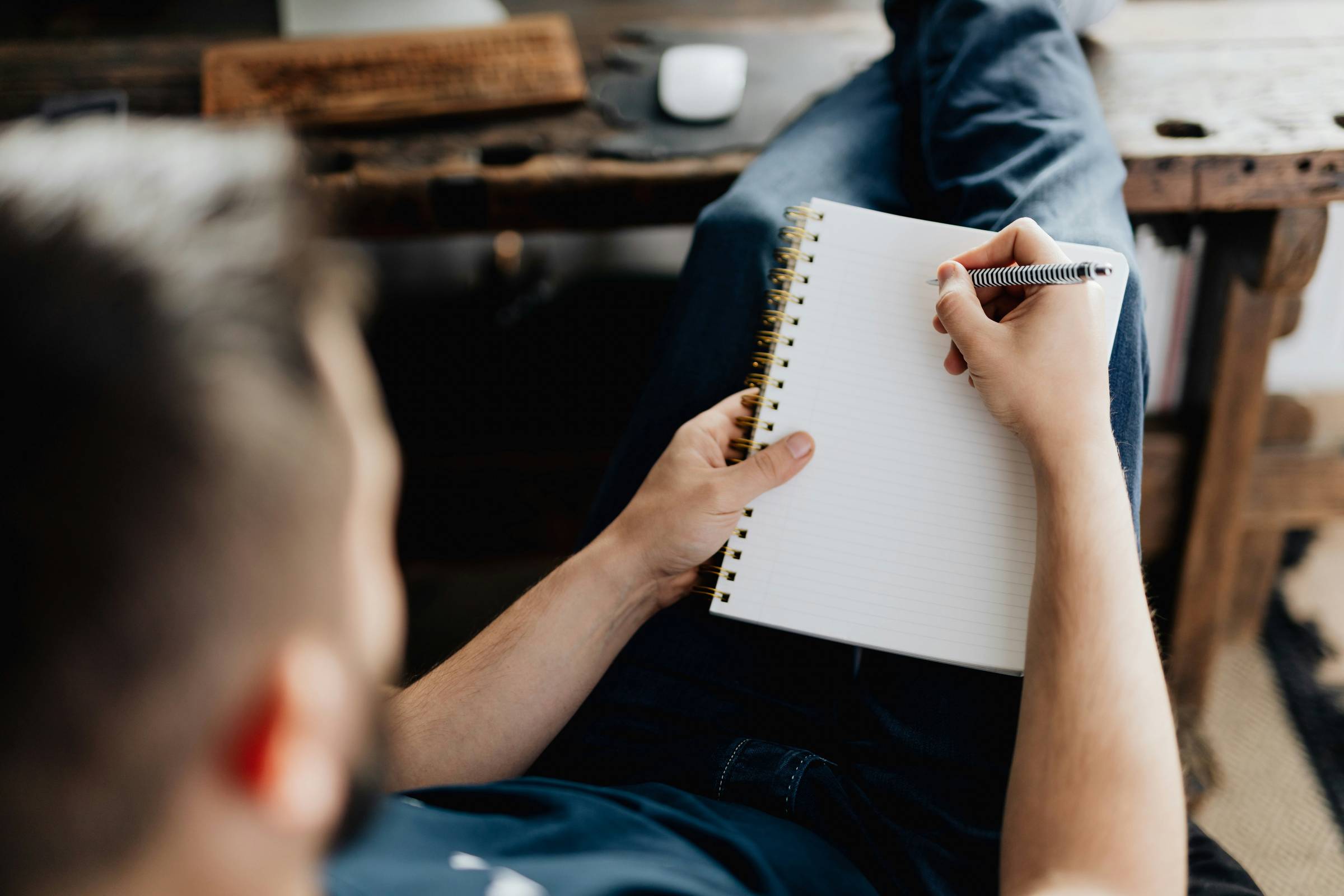Photo by <a href="https://unsplash.com/@deeezyfree?utm_content=creditCopyText&utm_medium=referral&utm_source=unsplash">Peter Olexa</a> on <a href="https://unsplash.com/photos/a-person-writing-on-a-piece-of-paper-EahB9XZt310?utm_content=creditCopyText&utm_