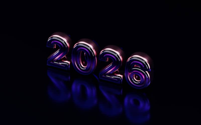 Metallic 2026 numbers on a dark reflective surface