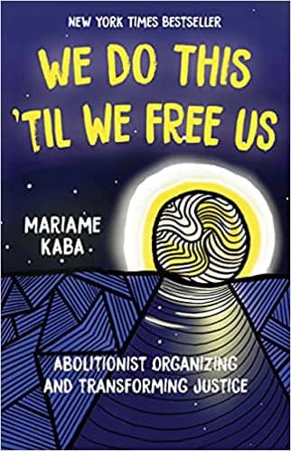 cover of We Do This Till We Free Us; abstract drawing of a moon slowly rising over a deep blue ocean, stars twinkling in the background