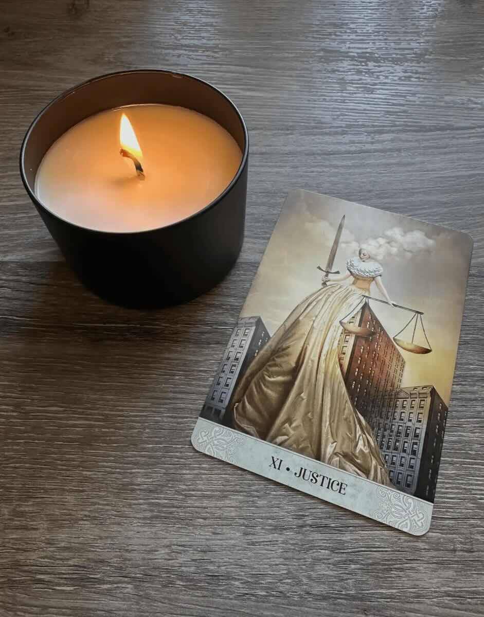 The Justice Card: a woman holding scales and a sword.