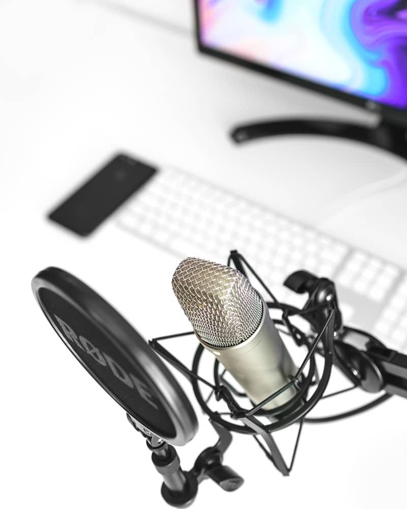 a microphone sitting on top of a desk next to a computer