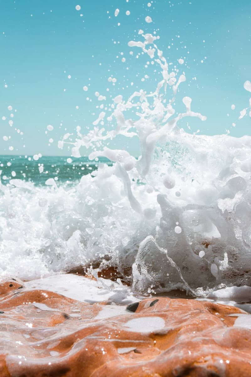 splash of water on brown textile