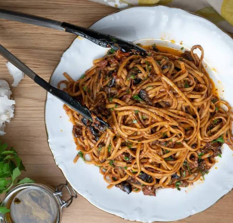plate of italian pasta puttanesca