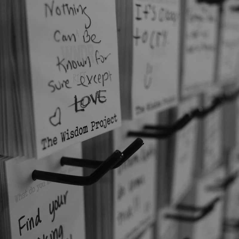 Words of wisdom are written on notecards.