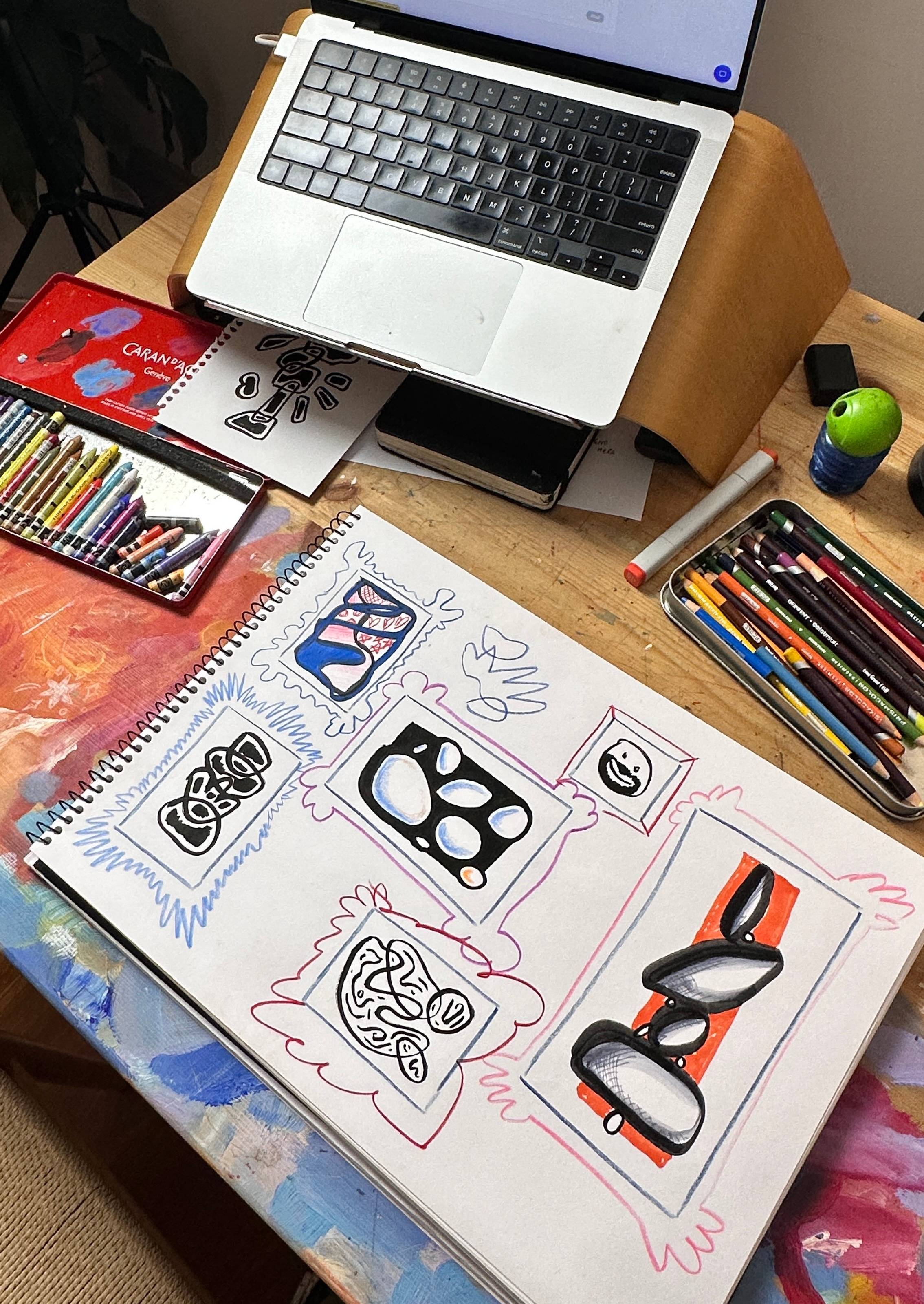 art table with drawings and materials