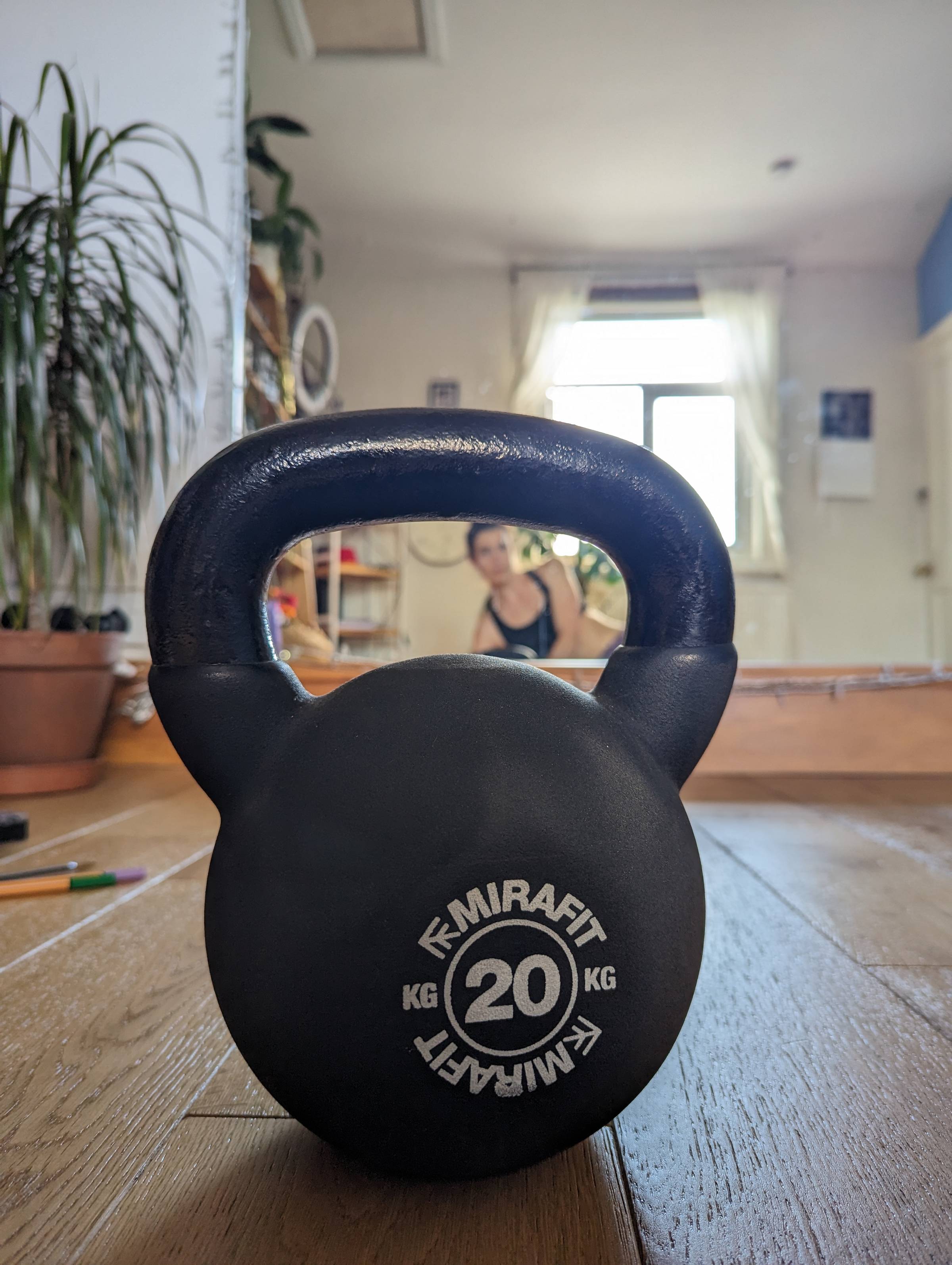 a 20kg kettlebell on wooden floor