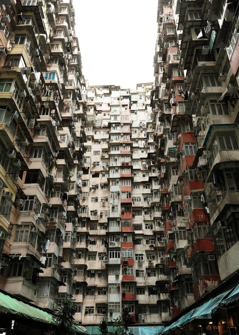 Overcrowded apartment buildings create a dense urban scene.