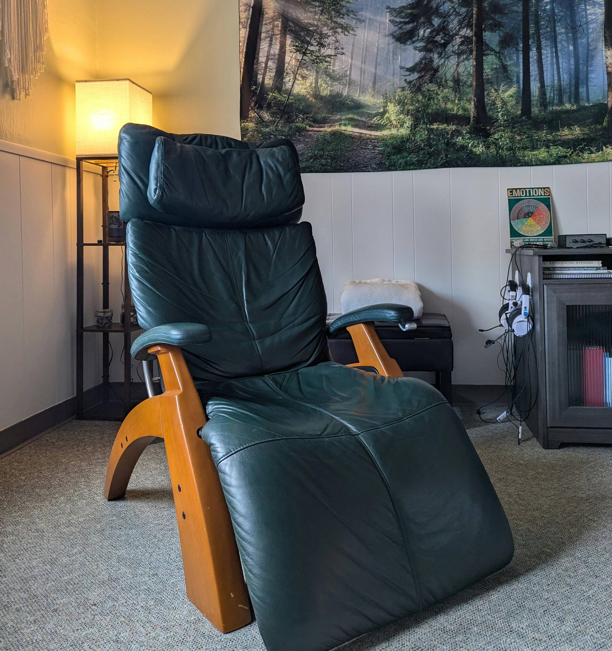 A comfortable chair sitting in the hypnotherapy room at integrative health and wellness center.