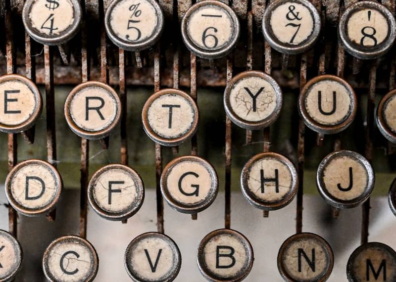 Close-up of an old typewriter's keyboard keys.