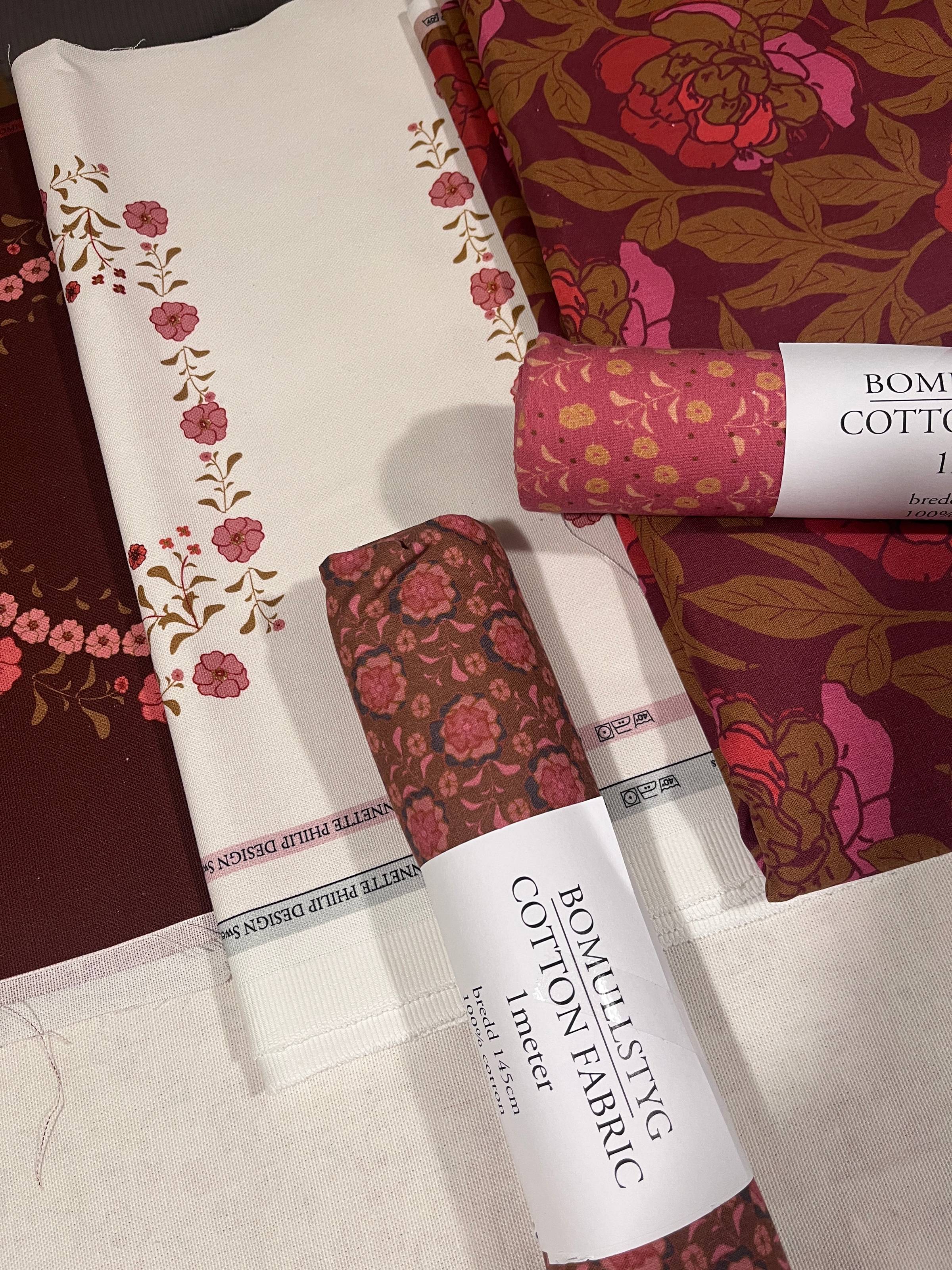 Bomullstyger i röda och olivgröna nyanser