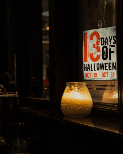 Candle on old wooden shelf