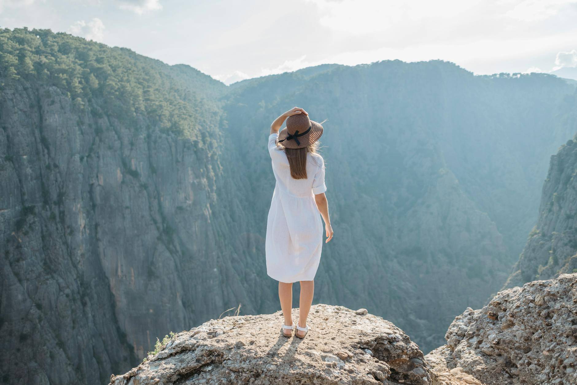 A woman at the top of a mountain