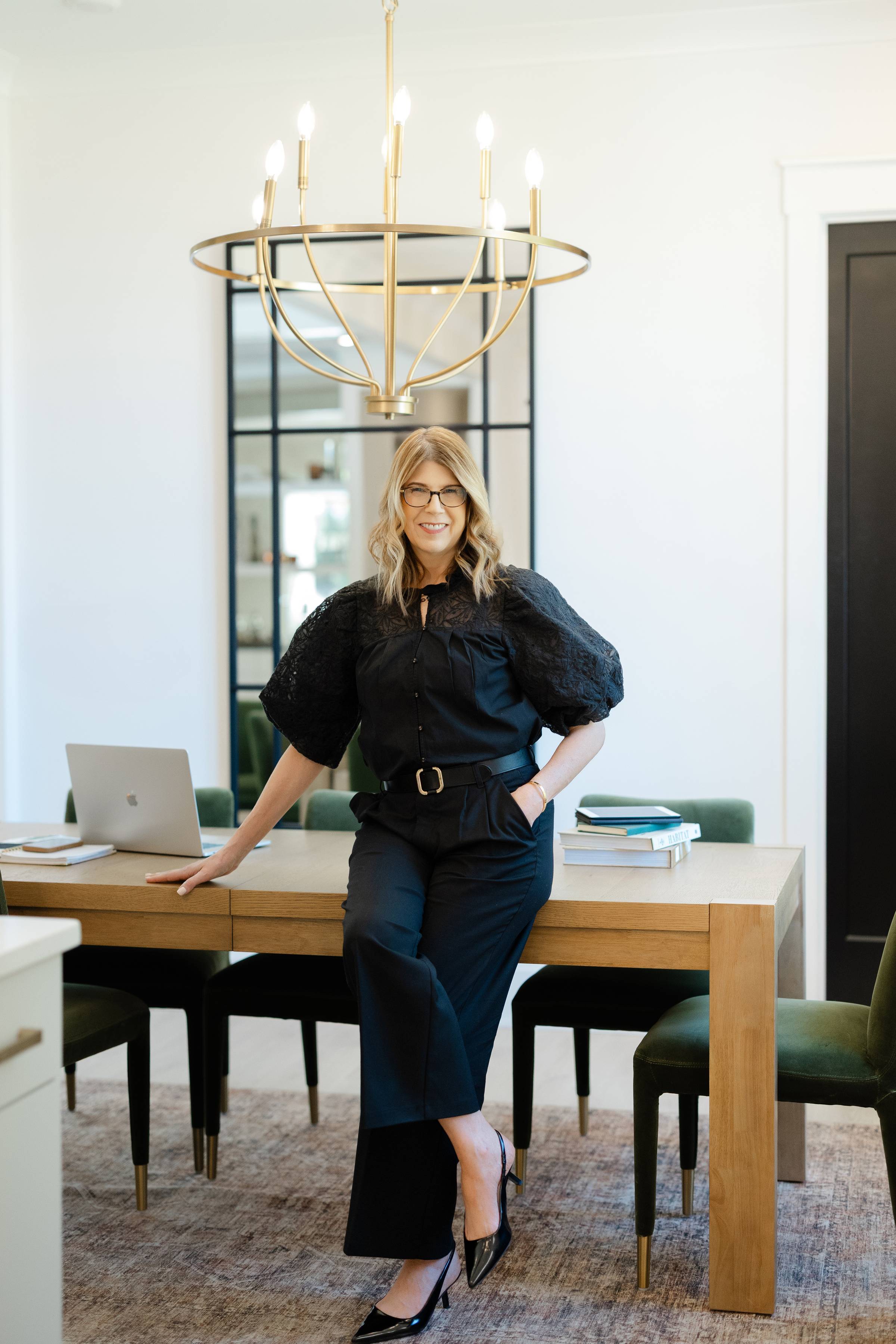 Deb Mitchell standing in a bright studio