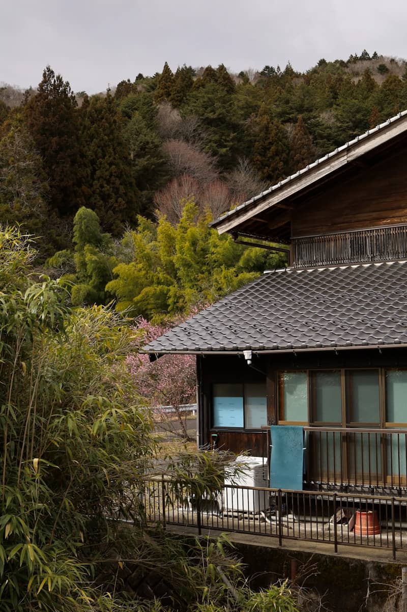 Traditional japanese house nestled in a lush forest.