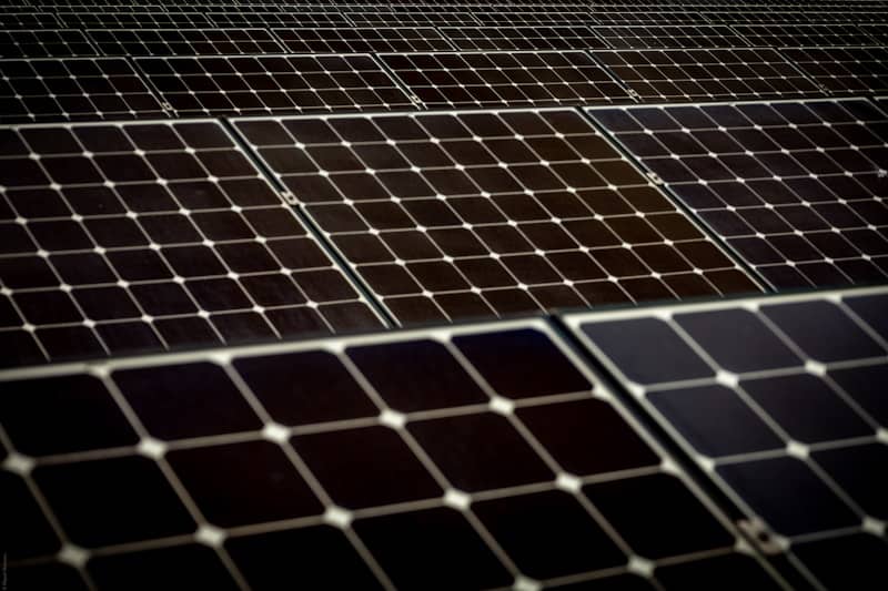 Solar panels are arranged in a vast array.