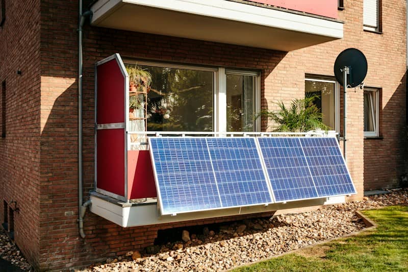 Solar panels on a brick building balcony