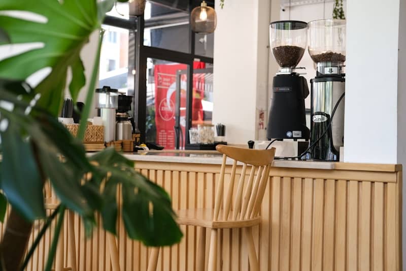 A cozy coffee shop interior with coffee grinders.