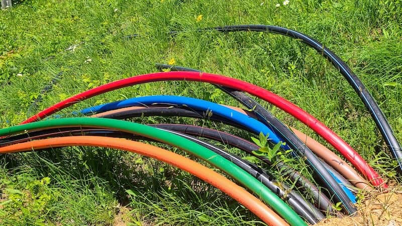 fiber optic cables being buried in ground