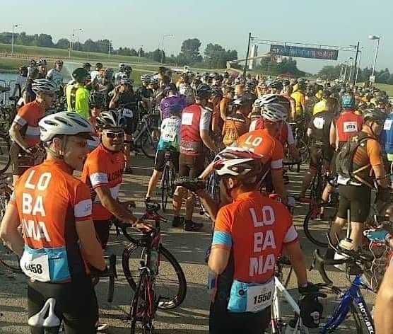 Cyclists gather at the start of an organized ride in the country