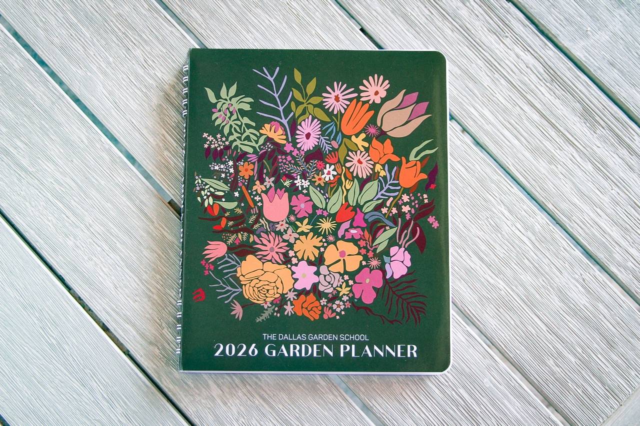 2026 NOrth Texas Garden Planner, colorful spiral notebook on wood table