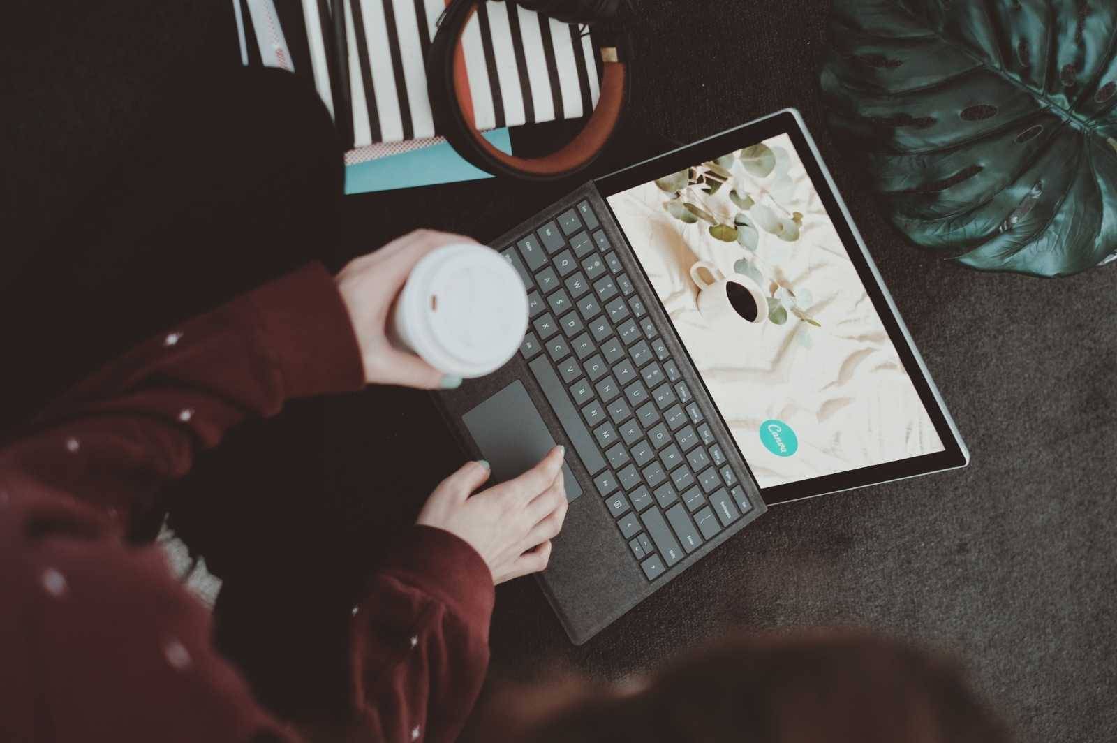 A writer working on her laptop. The image illustrates my situation, working full-time as a writer with ADHD who built a blogging business using unconventional strategies.