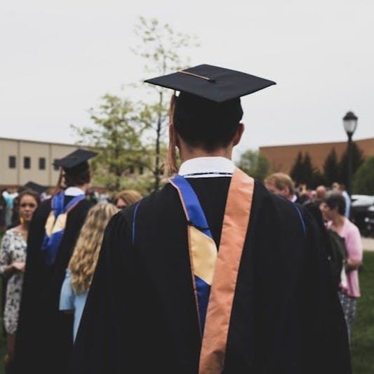 man wearing academic gown