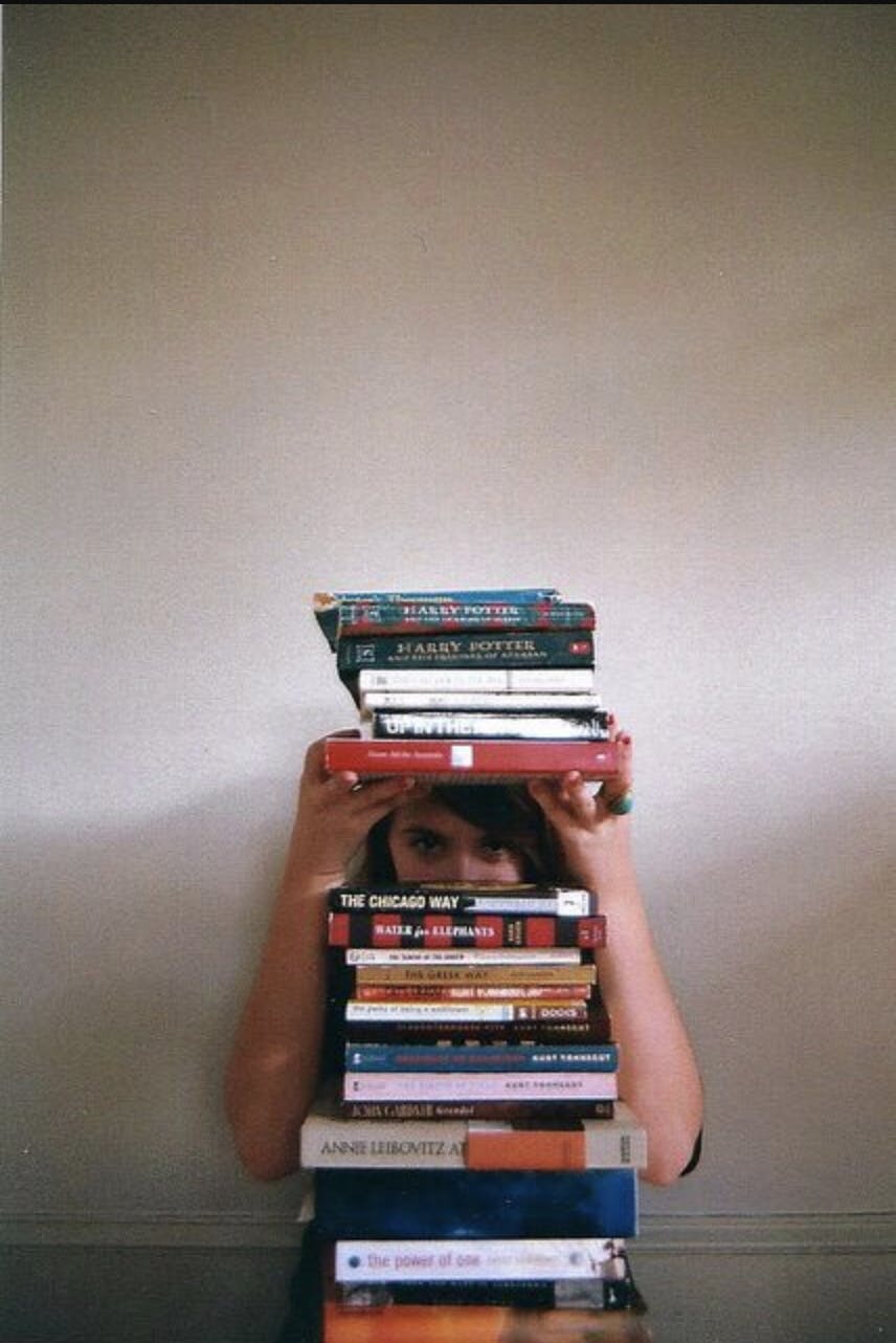 Girl with tons of books