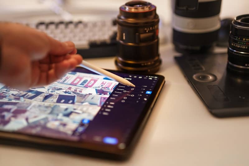 Editing photos on a tablet with a stylus.