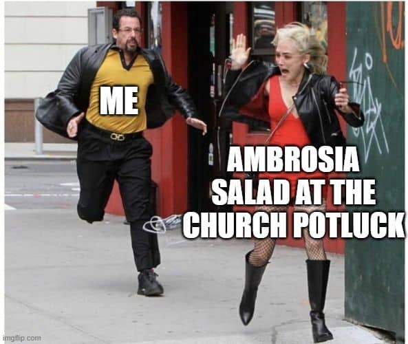 Meme showing a man chasing a scared woman. Caption over man says, "Me." Caption over woman says, "Ambrosia salad at the church potluck."