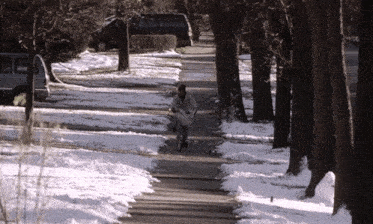 Newspaper boy on a bike falling down.
