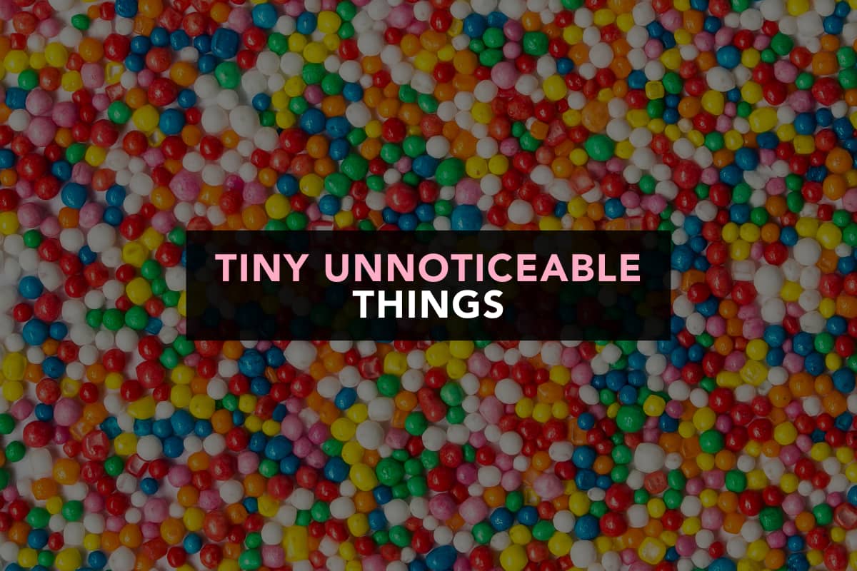 A photo of multicoloured hundreds and thousands (tiny pieces of candy). Over the image is a text panel that reads "Tiny unnoticeable things"