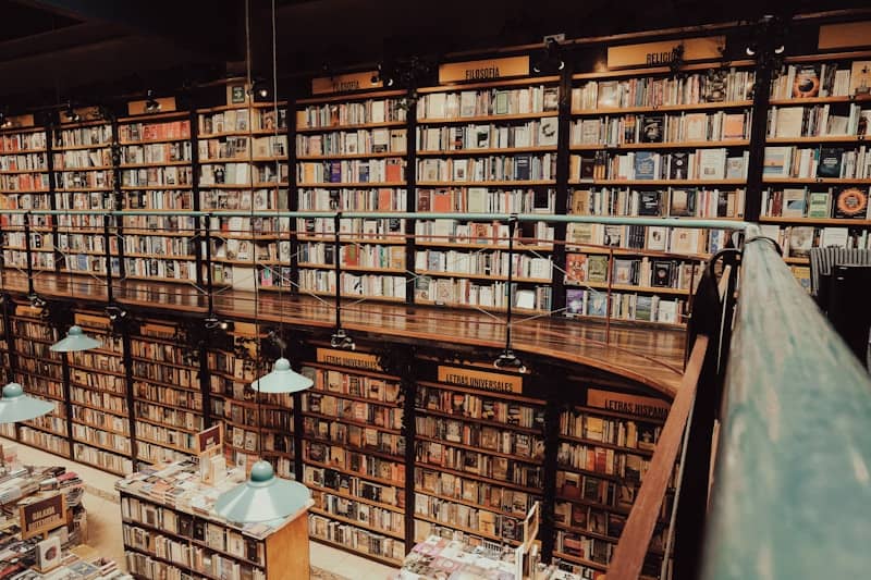 Wall of bookshelves filled with books in a library.