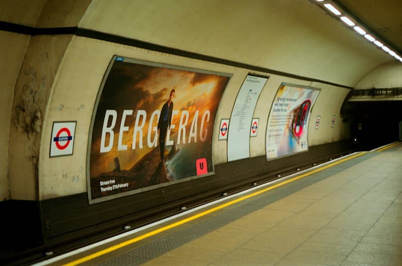 Advertisements on a london underground station platform.
