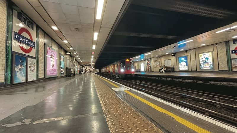 Train arriving at a london underground station platform.