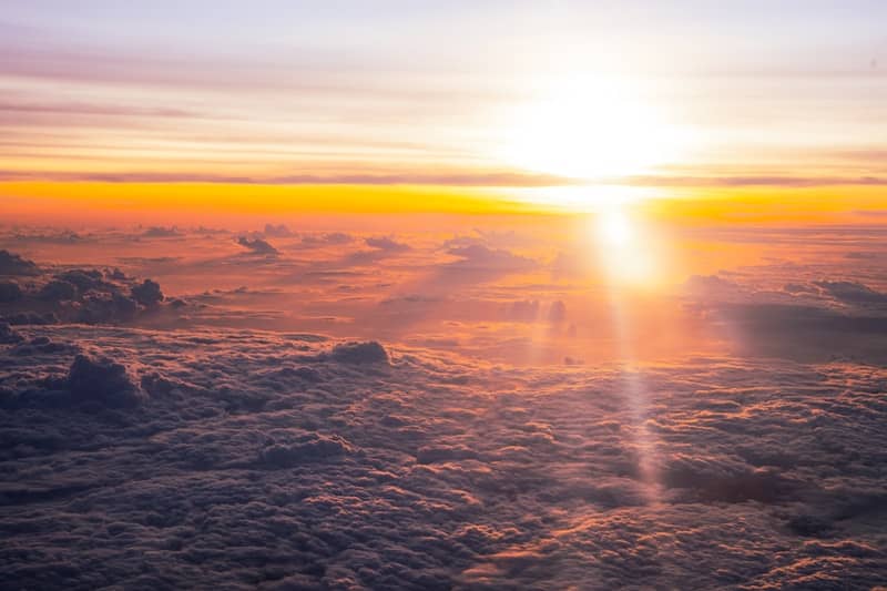 Sunrise over a sea of clouds from above